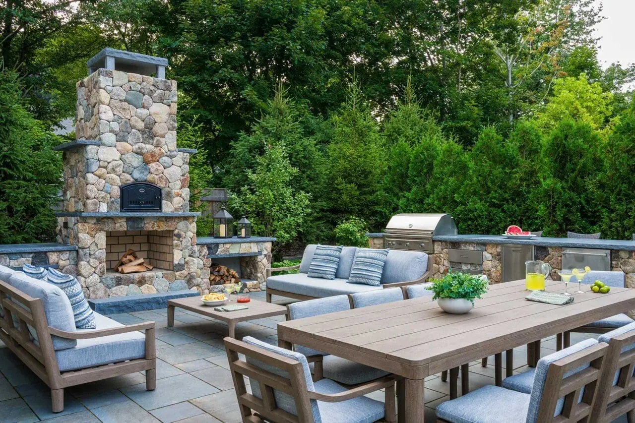 Green Giant arborvitae in Boston, Massachusetts, forming a tall, dense evergreen privacy screen along a residential property.