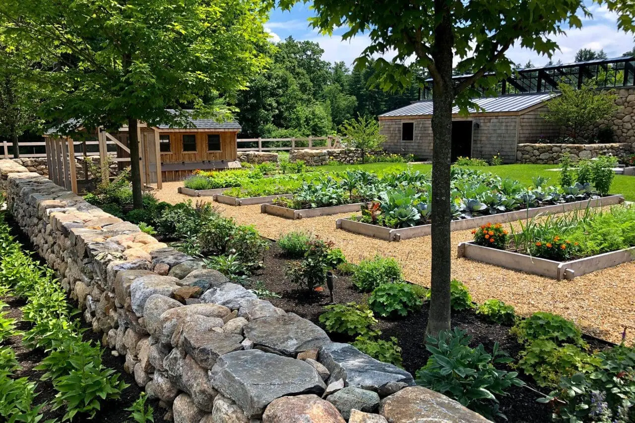 Carlisle, MA - A sustainable garden with raised vegetable beds, native plantings, and stone walls that blend function, beauty, and natural materials.