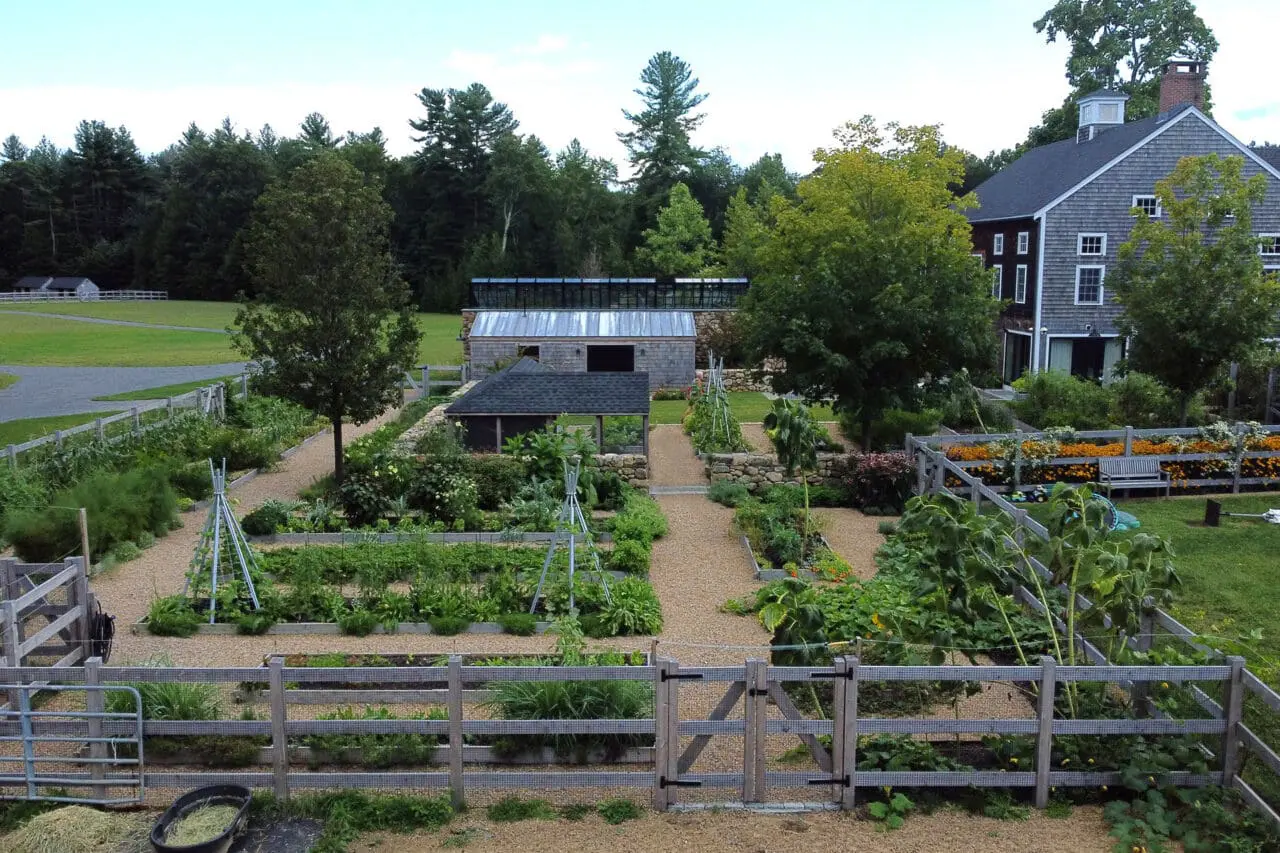 Carlisle, MA - An overhead view reveals the geometric layout of raised beds and stone walls within the productive garden.