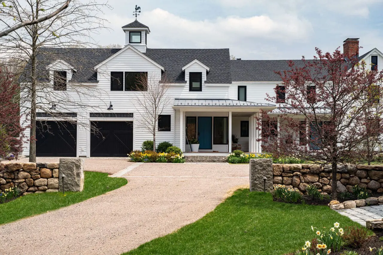Carlisle, MA - A gravel drive court is framed by stone walls, balancing function, durability, and formal estate character.