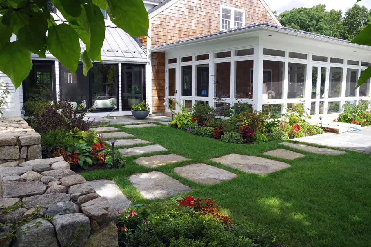 Carlisle, MA - Granite stepping stones cross the lawn, offering subtle circulation without interrupting the open landscape.