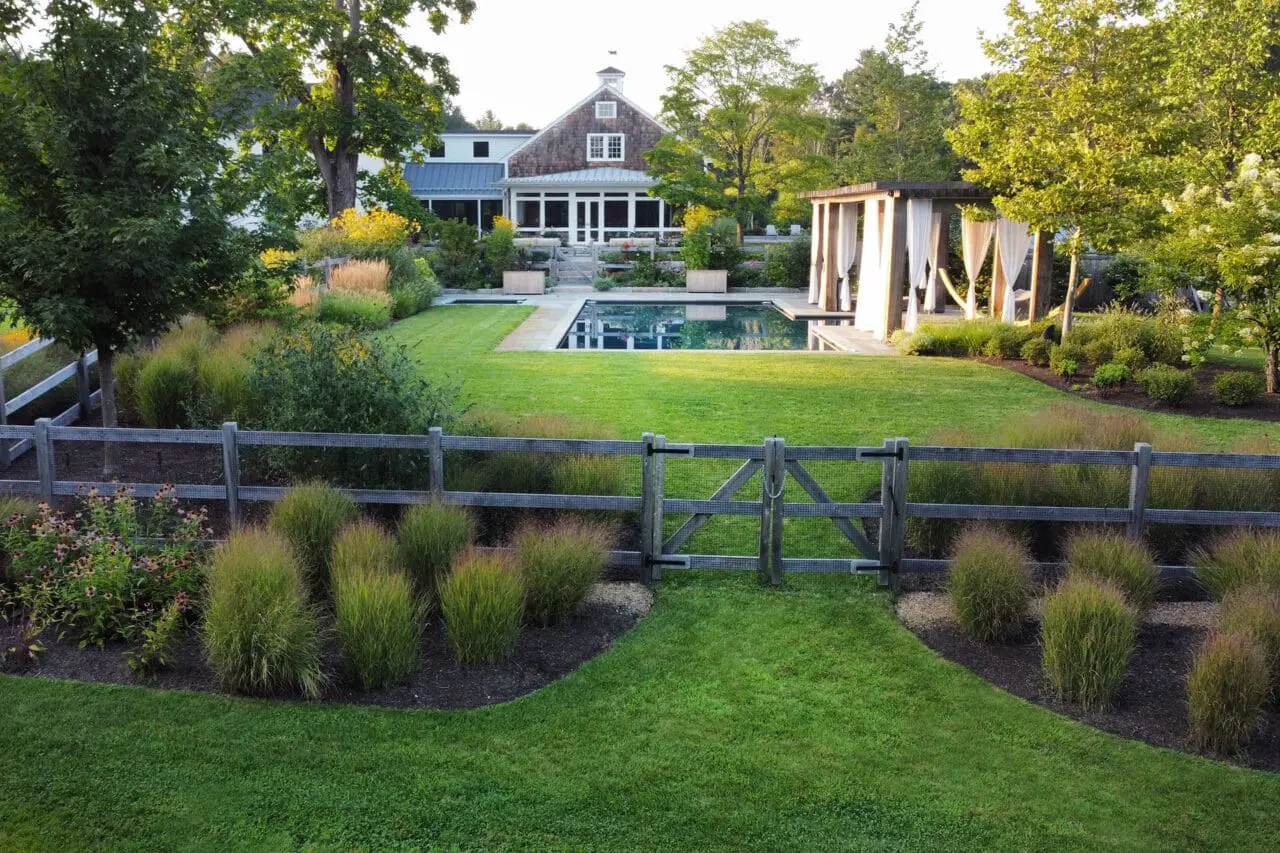Carlisle, MA - Subtle fencing and ornamental plantings define the pool area while preserving open views and maintaining estate-scale cohesion.