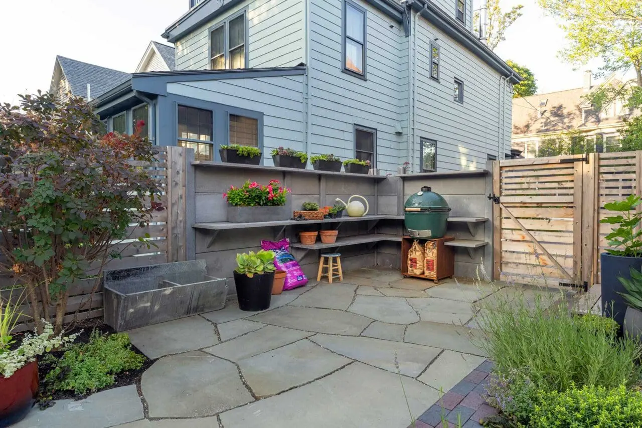 Cambridge, MA - A built-in outdoor prep station integrates cast concrete walls and cedar fencing, forming a defined workspace that supports cooking and entertaining. Photo credit: Dan Kaplan