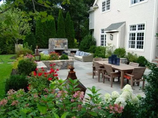 backyard bluestone patio with stacked stone retaining walls, Heather Lashbrook Jones