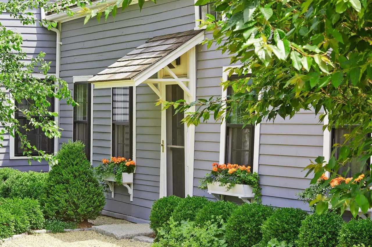 Wayland, MA - Window boxes add quick splash of color across the home's exterior. Photo: Charles Mayer
