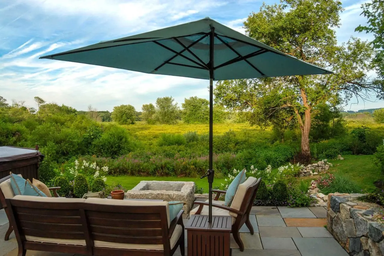 Wayland, MA - A pristine view of the Sudbury River from the new patio, complete with furniture and fire pit.