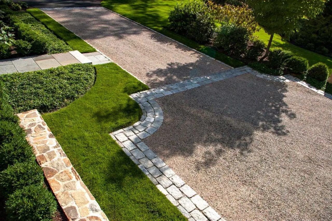 Wellesley Hills, MA - The peastone drive bordered by granite block provides a welcome entrance.
