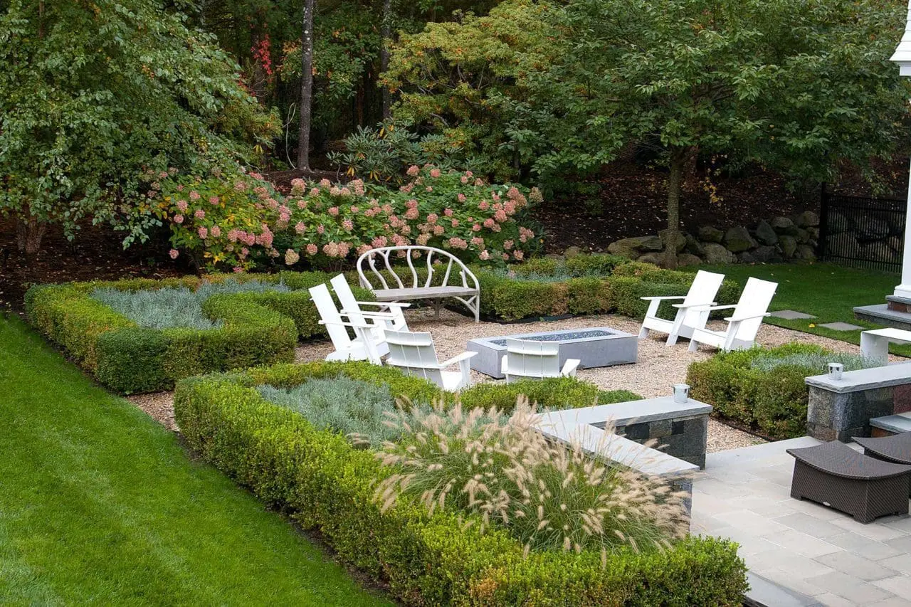 Weston, MA - Manicured hedges and layered plantings shape an intimate garden built for seasonal interest.