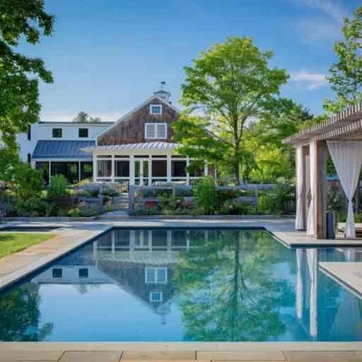Carlisle, MA - This Carlisle pool and cedar pergola landscape frames outdoor dining, shade, and poolside relaxation within a cohesive backyard design.