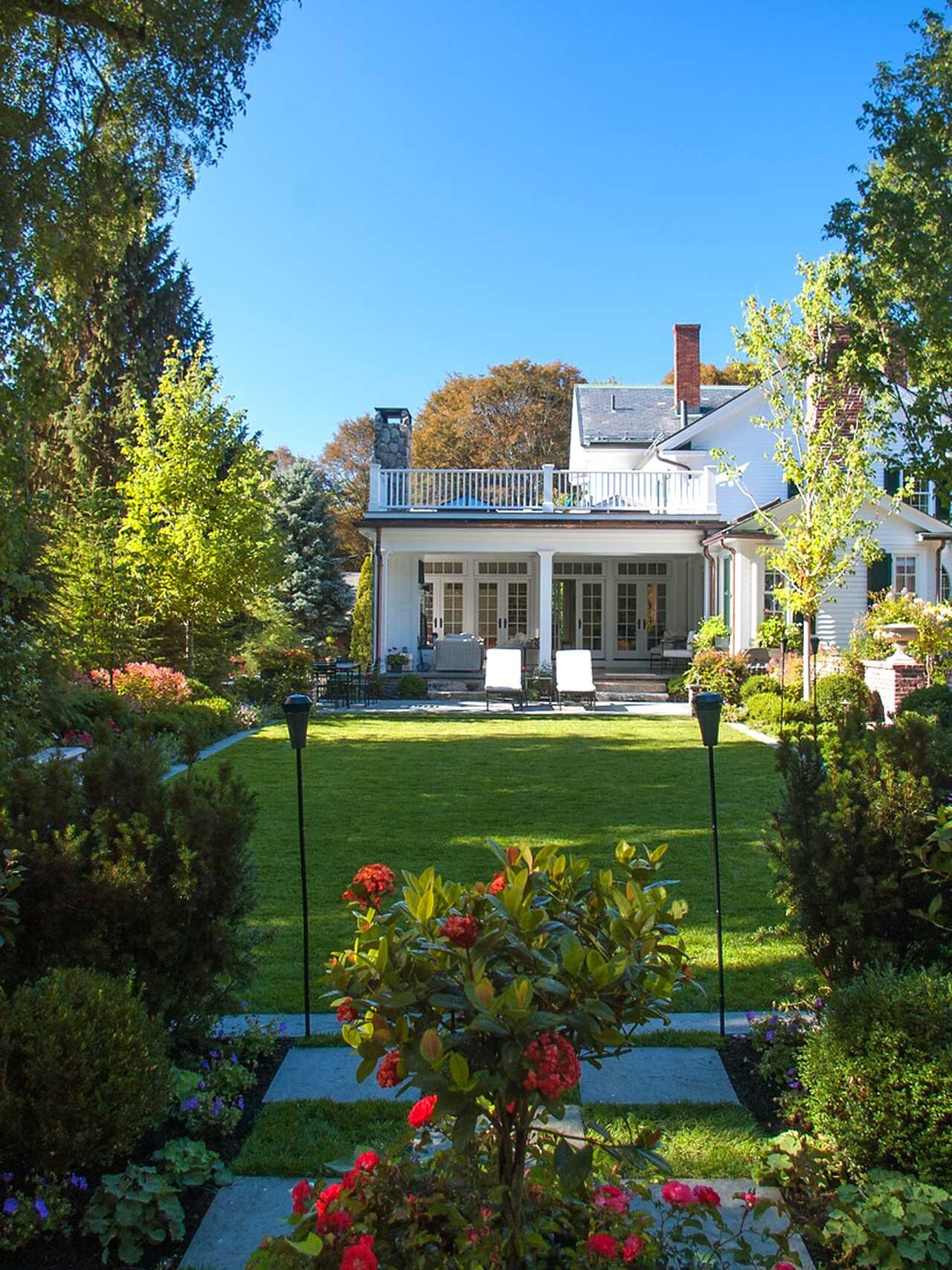 Belmont, MA - A perfect lawn ready for play, edged with trees, shrubs, and perennials that add color and texture to the space.