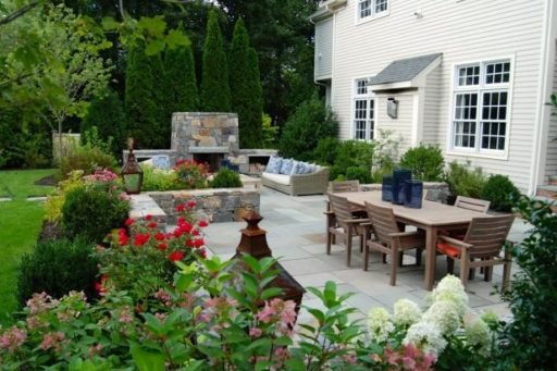 backyard bluestone patio with stacked stone retaining walls, Heather Lashbrook Jones