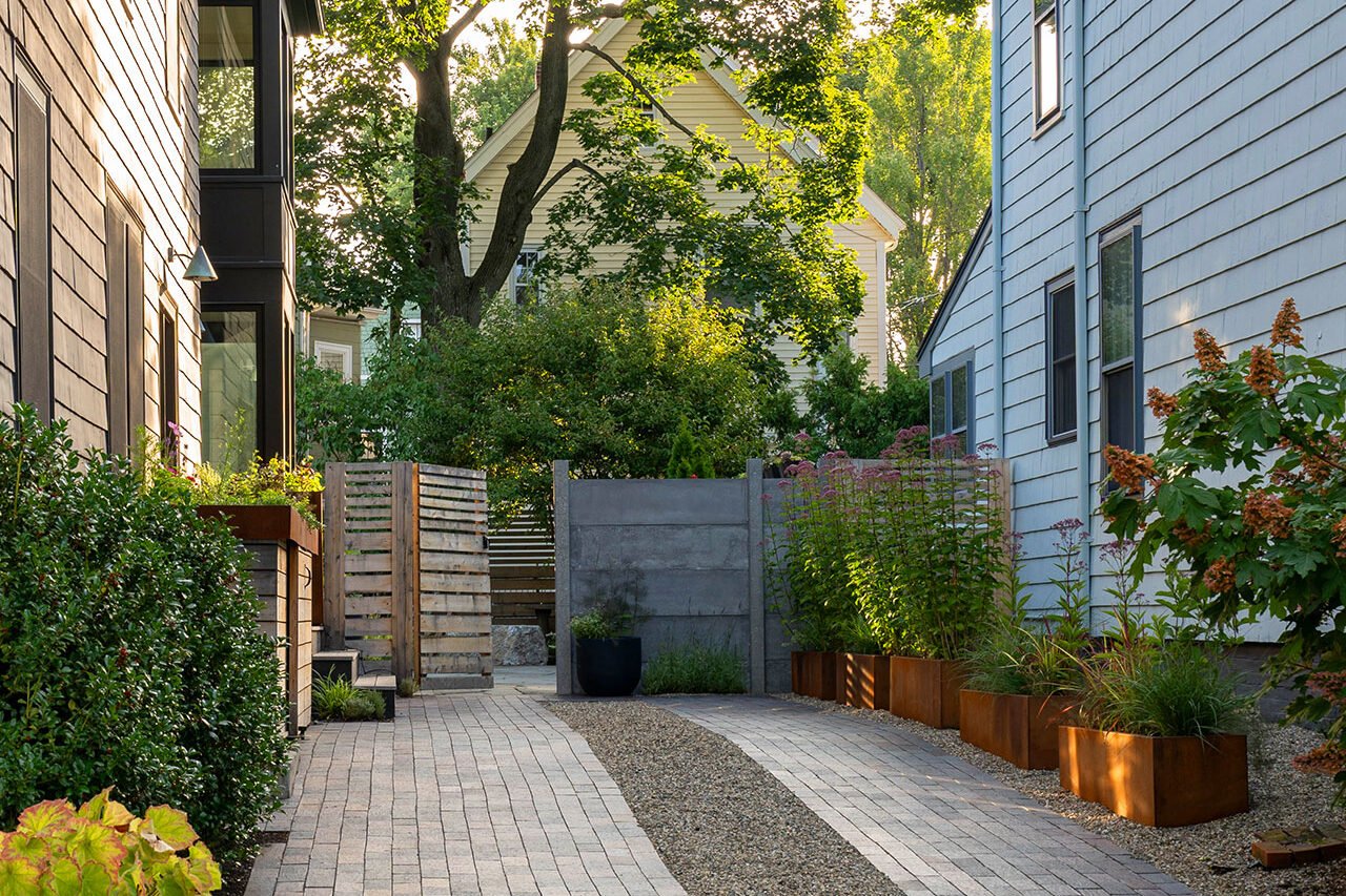 Cambridge, MA - This modern paver driveway features gravel inlay for texture and contrast, combining crisp lines with permeability and a contemporary architectural feel.