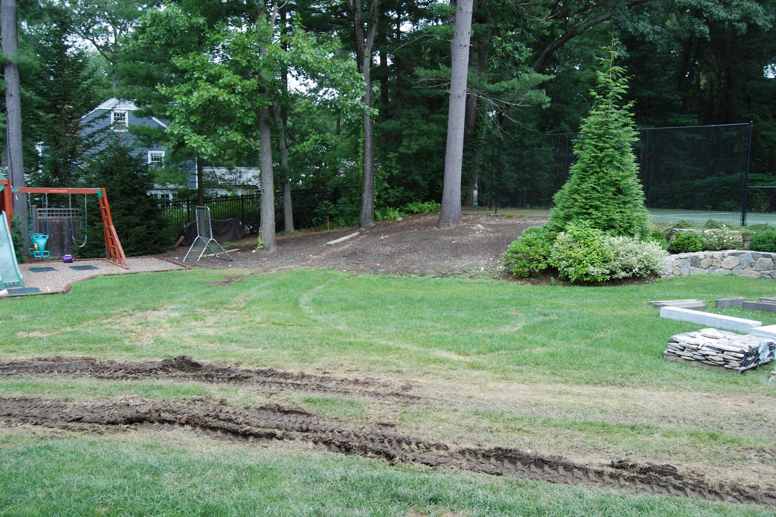 Wellesley backyard lawn before pool and landscape renovation