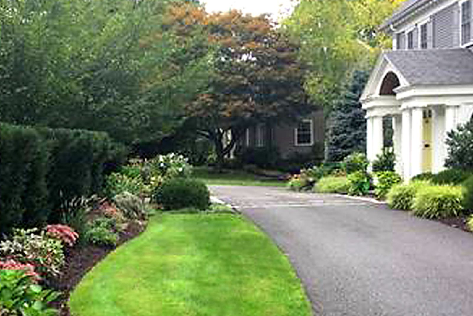 Wellesley entryway after granite cobblestone courtyard and landscape renovation