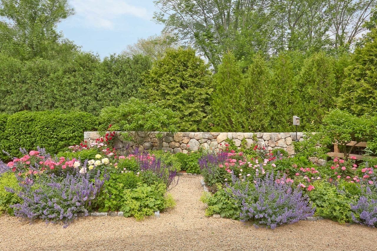 Wayland, MA - Year round screening and stone walls create a sense of privacy.